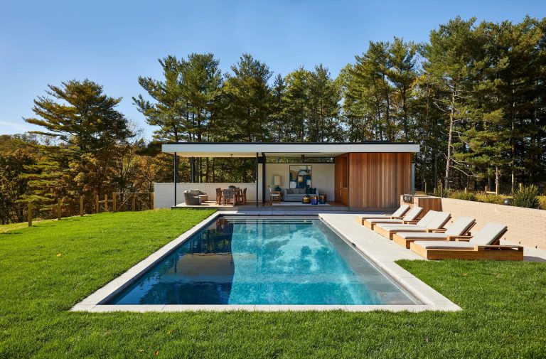 1950s backyard rectangular pool house photo in New York