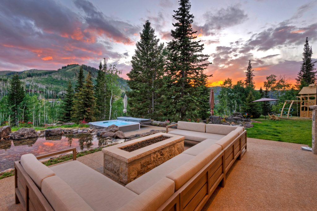 Outside, there is a covered and heated dining space with a built-in 60" Wolf BBQ. The main patio has a huge firepit and seating for 10-12 people on 3 comfy outdoor couches. And just steps off the main patio is a luxurious 8 person Hotsprings hot tub positioned to offer incredible views while enjoying a soak. All of the outdoor patios and walkways are heated concrete so no shoveling required.