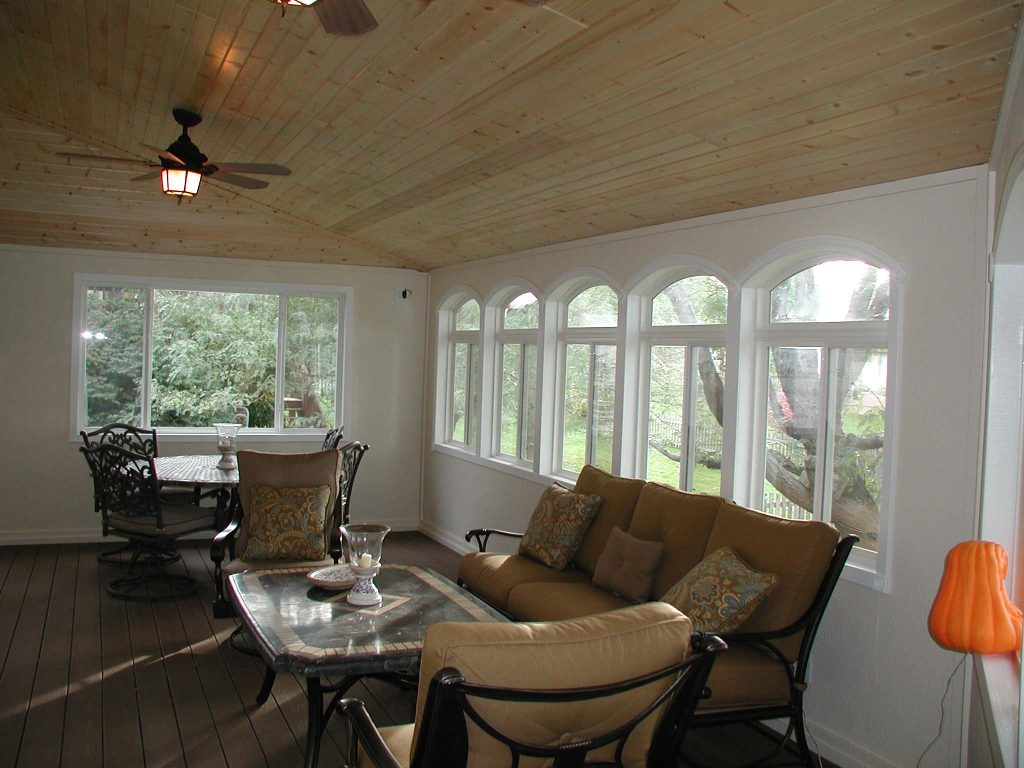 3-Season room with composite deck floor, and vaulted wood carsiding ceiling.