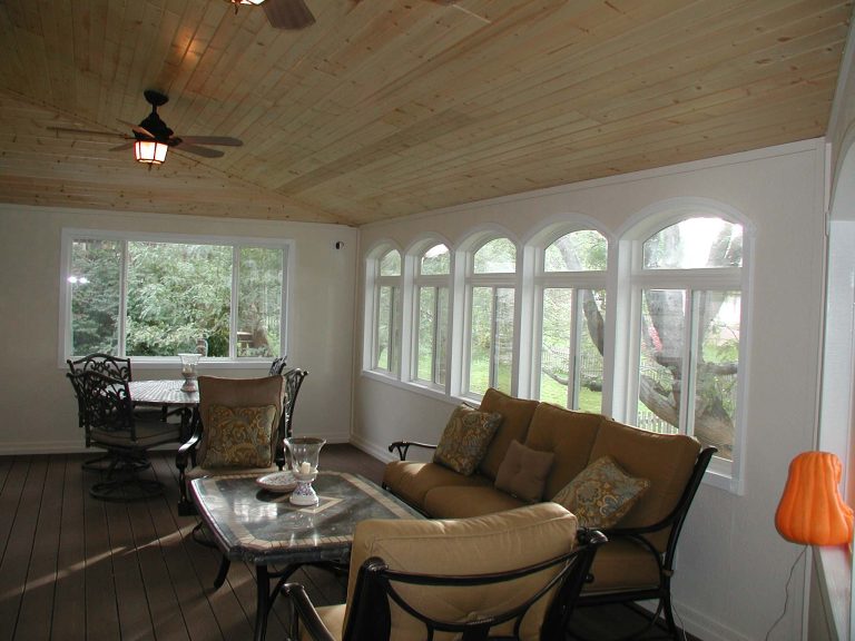 3-Season room with composite deck floor, and vaulted wood carsiding ceiling.