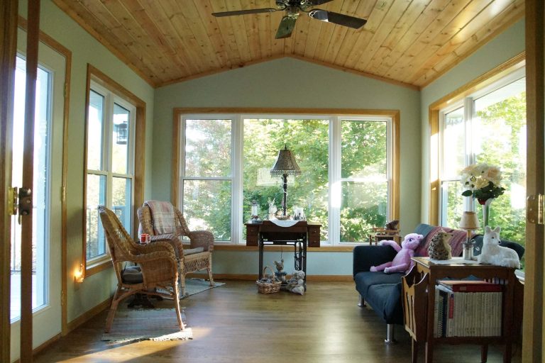 4 season porch we completed for the Bergmann family in Savage, MN. Photo Property of Lindus Construction This is an example of a mid-sized rustic porch design in Minneapolis with a roof extension. by Lindus Construction/Midwest LeafGuard | Outdoor Photos | Porch | Landscaping | Landscape Design | Outdoor Living Space | Porch Design Ideas | Outdoor Living Space Ideas | Backyard Design