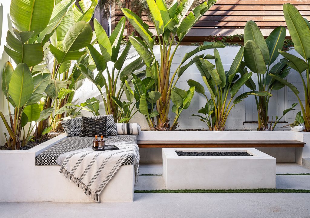 Trendy concrete patio photo in Los Angeles with a fire pit and no cover