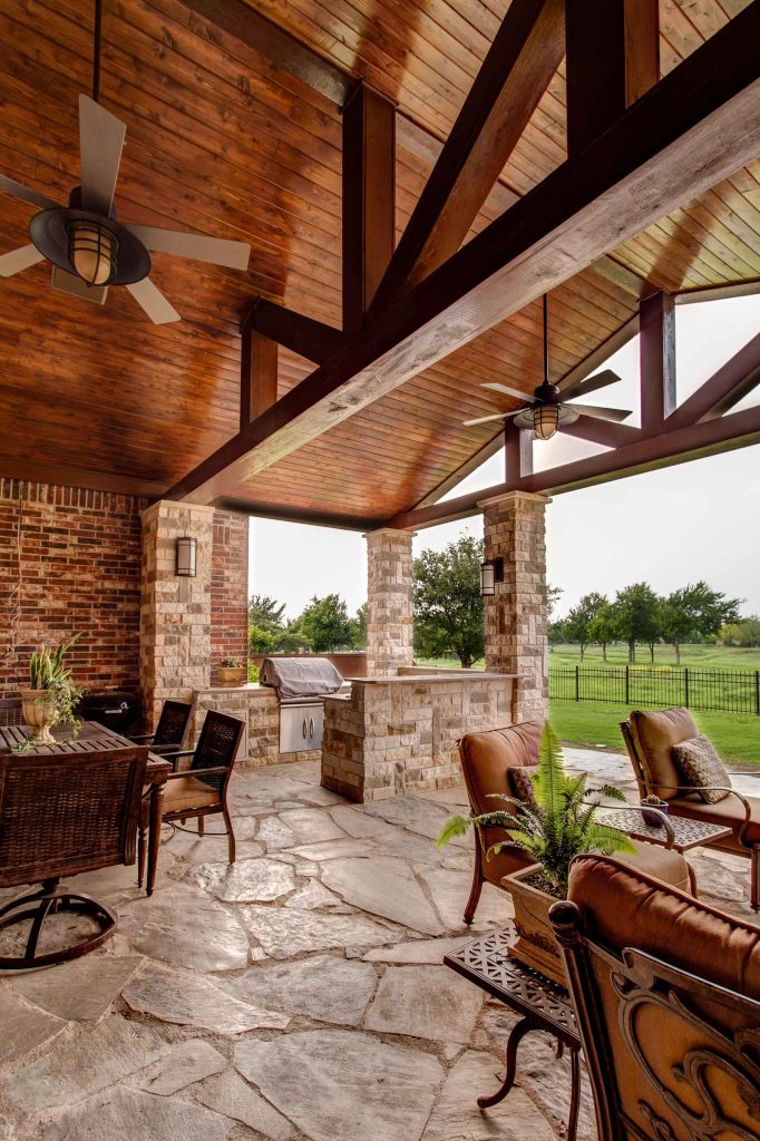 600sf patio addition to an existing traditional home. Use of stone for patio, benches and columns. Stained tongue & groove pine ceiling. Heavy timber beams. Lisa Piper Photography by 708 Studios, LLC | Outdoor Photos | Porch | Landscaping | Landscape Design | Outdoor Living Space | Porch Design Ideas | Outdoor Living Space Ideas | Backyard Design