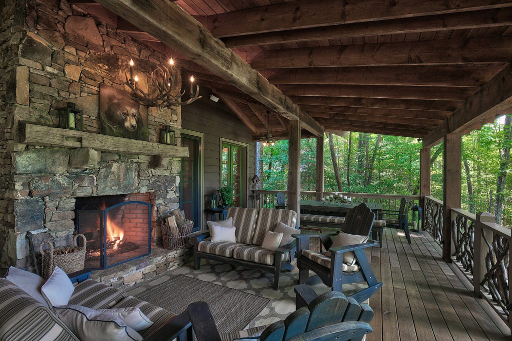 Mountain style deck photo in Other with a fire pit and a roof extension
