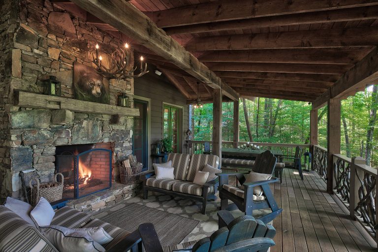 Mountain style deck photo in Other with a fire pit and a roof extension