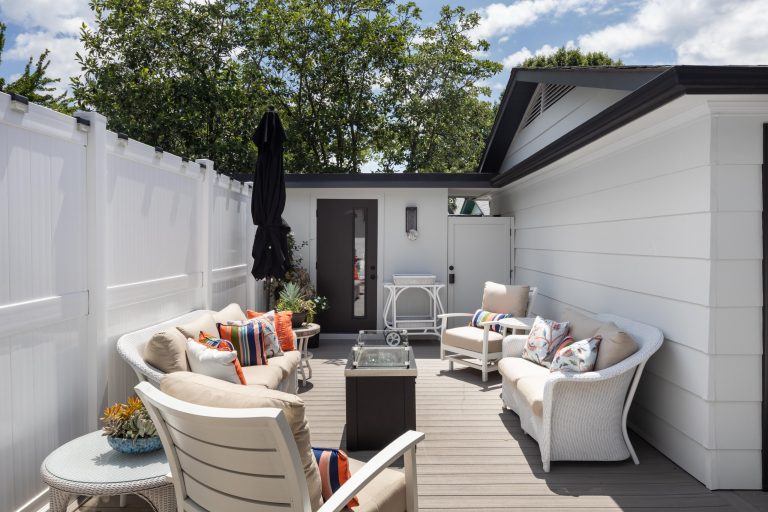 Example of a mid-sized transitional backyard deck design in Other with a fire pit and no cover