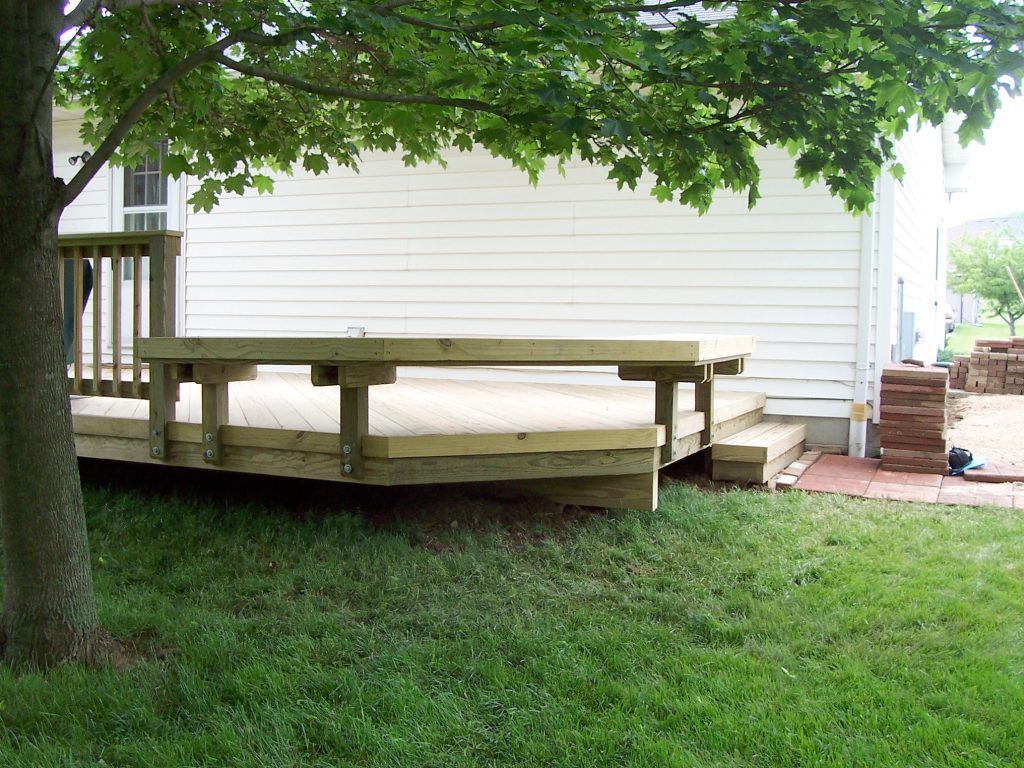 A Wood Deck with a wood bench.