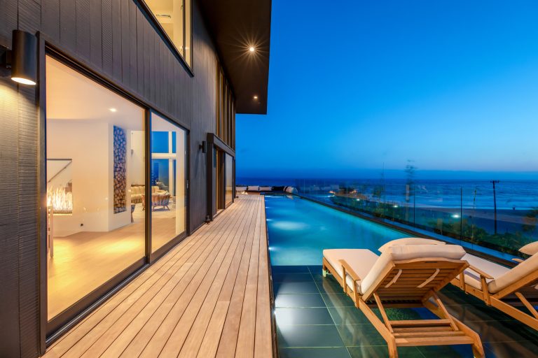 A beautiful modern coastal home I worked on at Fiore Landscape Design. We designed a zero-edge pool and decks around the property overlooking the Pacific Ocean.