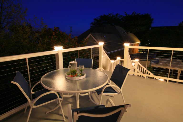 A beautiful new deck and deck railing off of the kitchen offer a romantic venue for outdoor dining.

Contractor: AD Construction,
Designer: Shannon Demma by Beyond the Box | Design Collective | Outdoor Kitchens | Backyard Design | Outdoor Living Spaces | Landscape Design