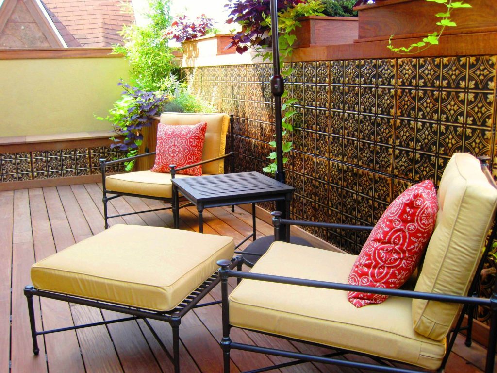 A beautiful patio / porch with tin accent wall for the garden. Shown is pattern #3 in Gold Brushed Bronze.