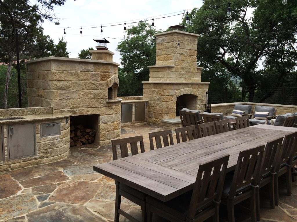 A built in pizza oven and kitchen storage make this outdoor patio a very usable space.
