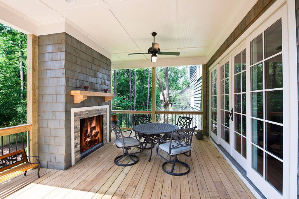 A charming spot to enjoy the fresh air next to a cozy fireplace.