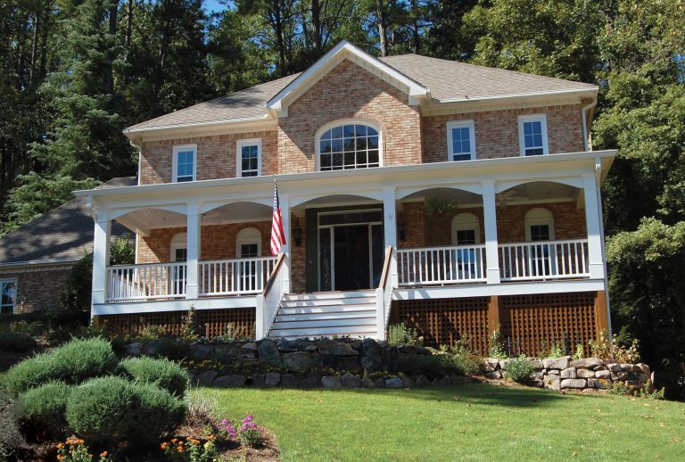 A grand traditional, southern front porch with lattice trim. Designed and built by Georgia Front Porch.