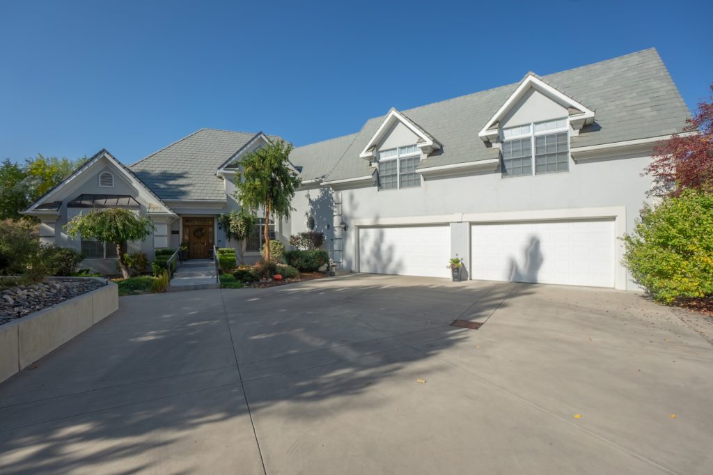 A heated tile entry walk and custom handrail welcome you into this beautiful home.