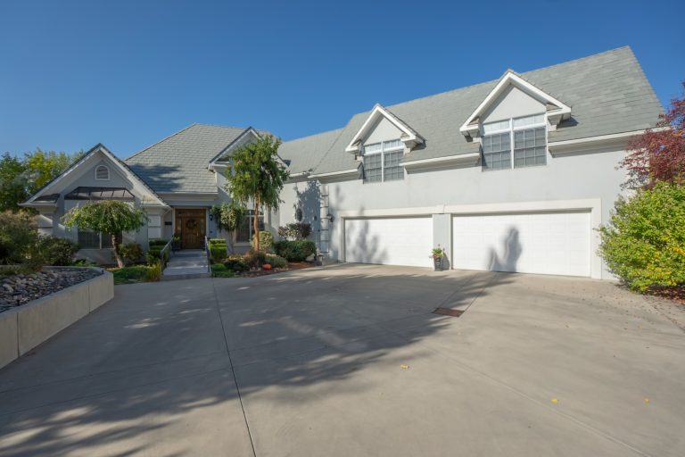 A heated tile entry walk and custom handrail welcome you into this beautiful home.