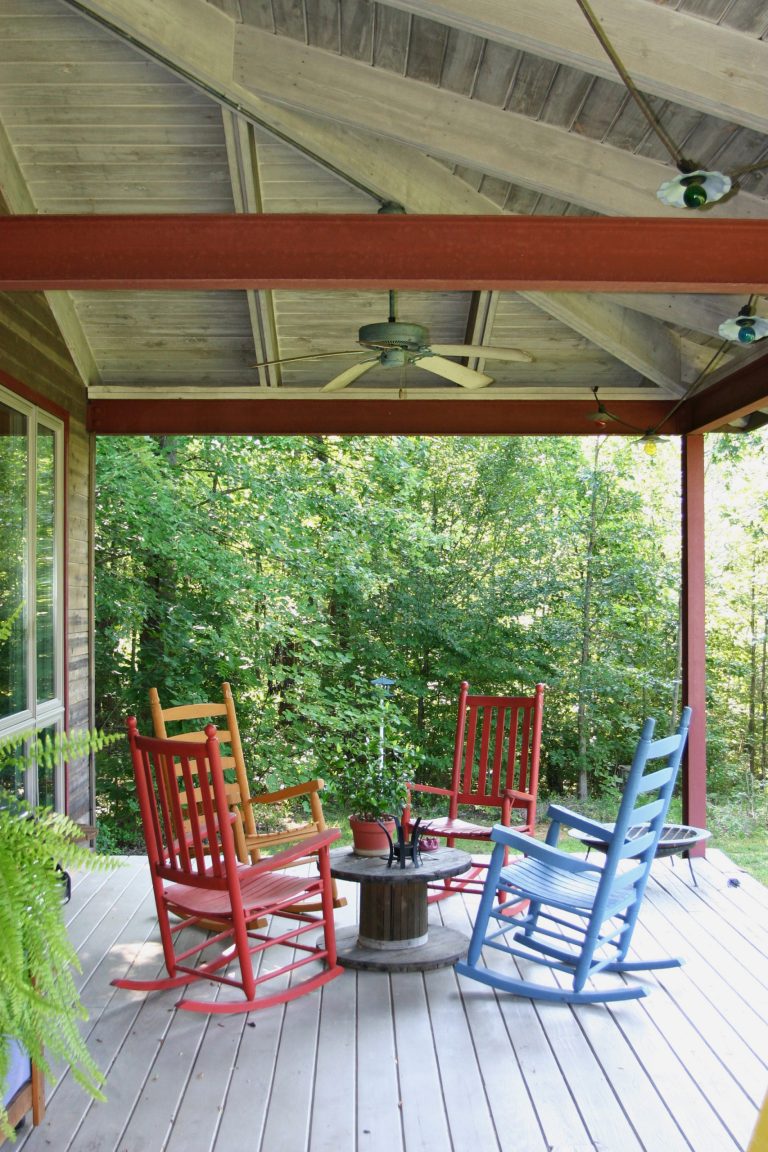 A large porch extends the living space of a home during the nice weather.
