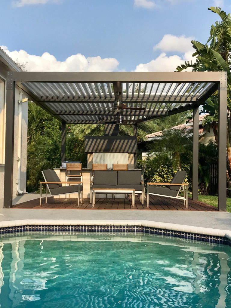 A modern version of the Altimate Pergola. The slats/louvers rotate 170 degrees for sun or shade and when closed are completely water-tight. Complimented by ceiling fans and dimming LED lights. by Alt's Seamless Spouting Llc | Outdoor Kitchens | Backyard Design | Outdoor Living Spaces | Landscape Design