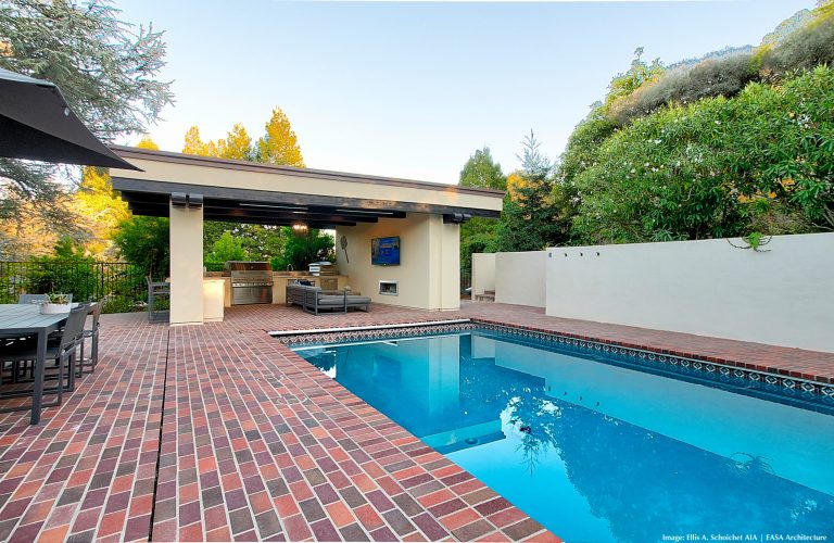 A new detached pavilion comprising an open outdoor kitchen and lounge area with fireplace and TV and a secluded 115 sf. enclosed cabana bath/changing room. Total roofed area is 411 sf.