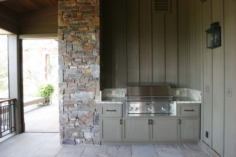 A nice outdoor barbecue tucked into the porch