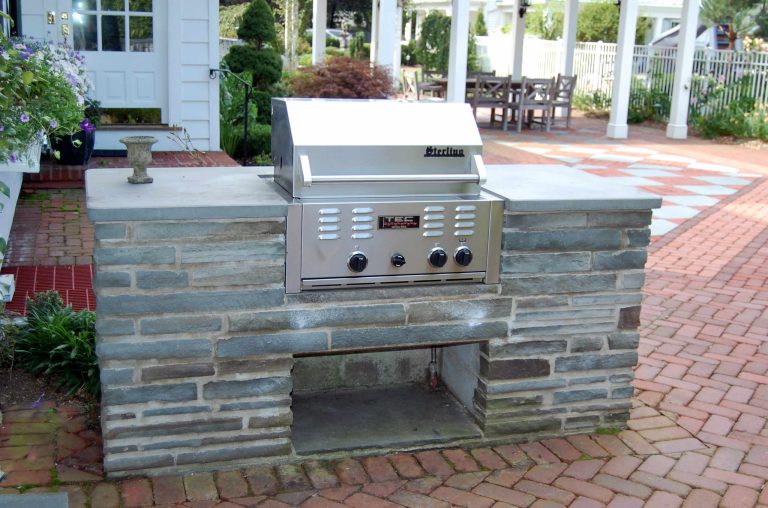 A outdoor kitchen area is near the patio and convienent to the kitchen door. PA bluestone countertop, bluestone veneer on base.