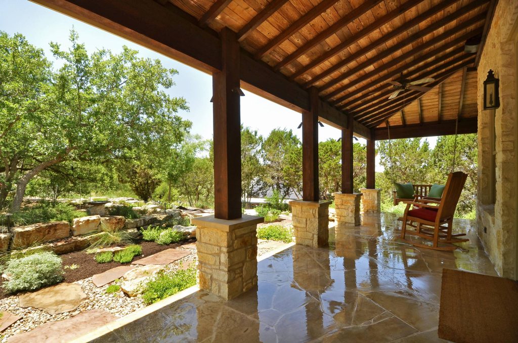 A picture of relaxation - the front porch of the casita surrounded by over an acre of natural landscaping, all designed and built by Southern Landscape. by Southern Landscape | Outdoor Photos | Porch | Landscaping | Landscape Design | Outdoor Living Space | Porch Design Ideas | Outdoor Living Space Ideas | Backyard Design