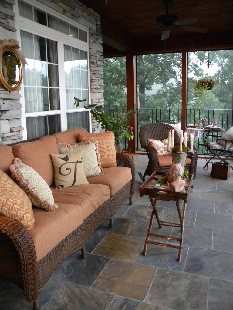 A sitting space and a table for dining outside.