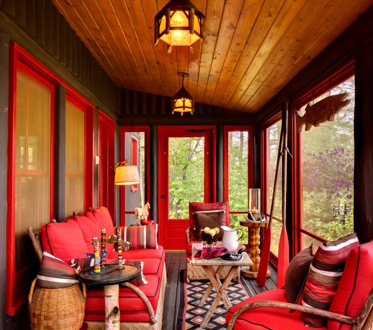 A smaller porch serves the guest rooms.