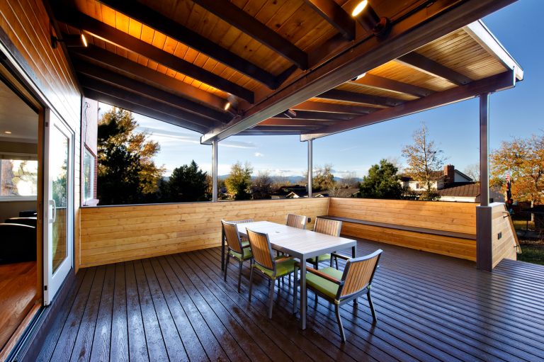 A steel and wood butterfly pavillion connecting the interior to the exterior living and the mountain views beyond. Tony Gallagher Photography