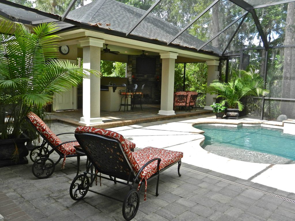 A summer kitchen and outdoor living area addition. The pool was designed by Surfside Pools in Jacksonville FL.
