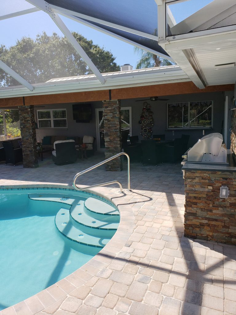 A transformed backyard oasis complete with a fresh new summer kitchen