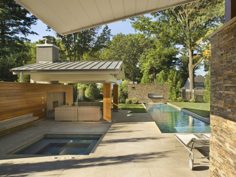 A view from the back of the house at the lap pool, hot tub and cabana. We use the same palet of materials from the home, and carried them on to the entire property.