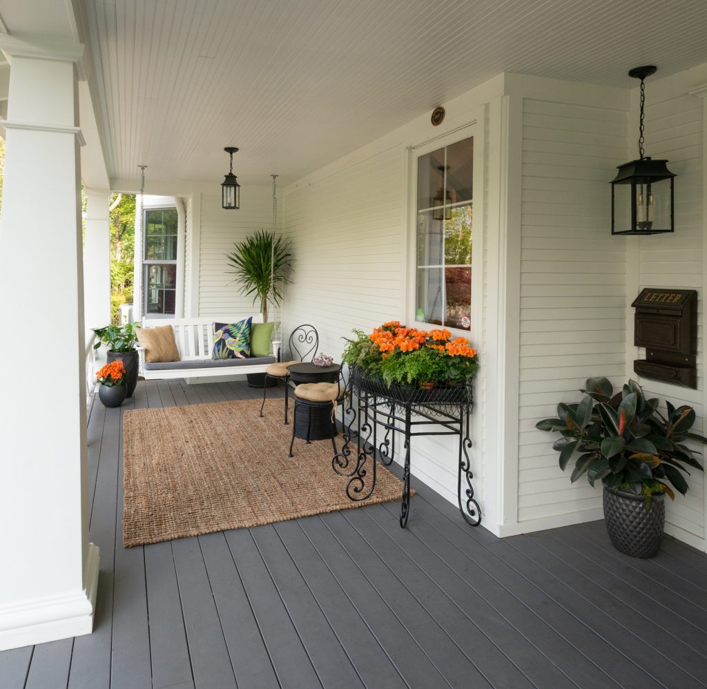 Added wrap around front porch photo by Karen Knecht Photography
