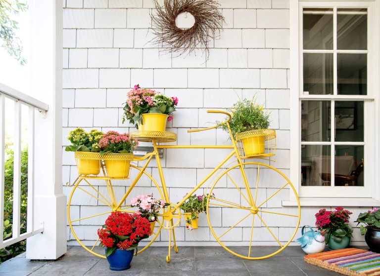Adorable and unique plant stand shaped like a bright yellow bicycle. Products and styling by Wayfair.com