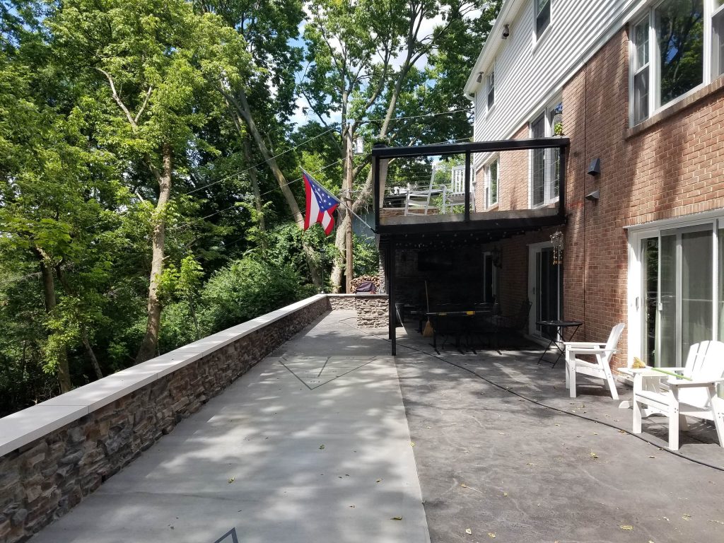 After - Grilling area, outdoor living space, shuffle board court, seating wall and cable railing