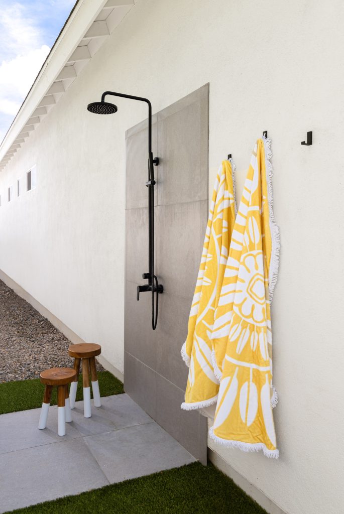 After a day of fun outdoors, it is always nice to spray off before going back into the house. This complete shower is tucked away around the corner of the house to add to the feel of privacy.