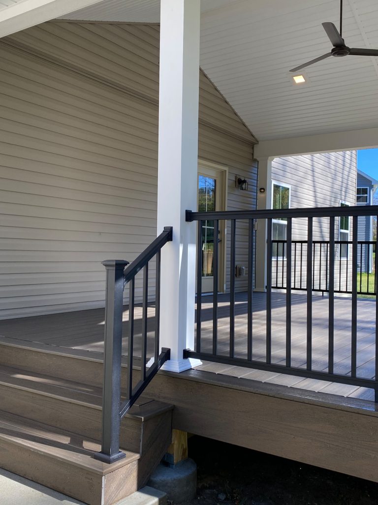An extension of this home's living space that opens up the view of future potential in the remainder of this brand new backyard. The use of a LVL beam creates a feeling of expanse and accessibility. by Comfort Zones By Design LLC | Outdoor Photos | Porch | Landscaping | Landscape Design | Outdoor Living Space | Porch Design Ideas | Outdoor Living Space Ideas | Backyard Design