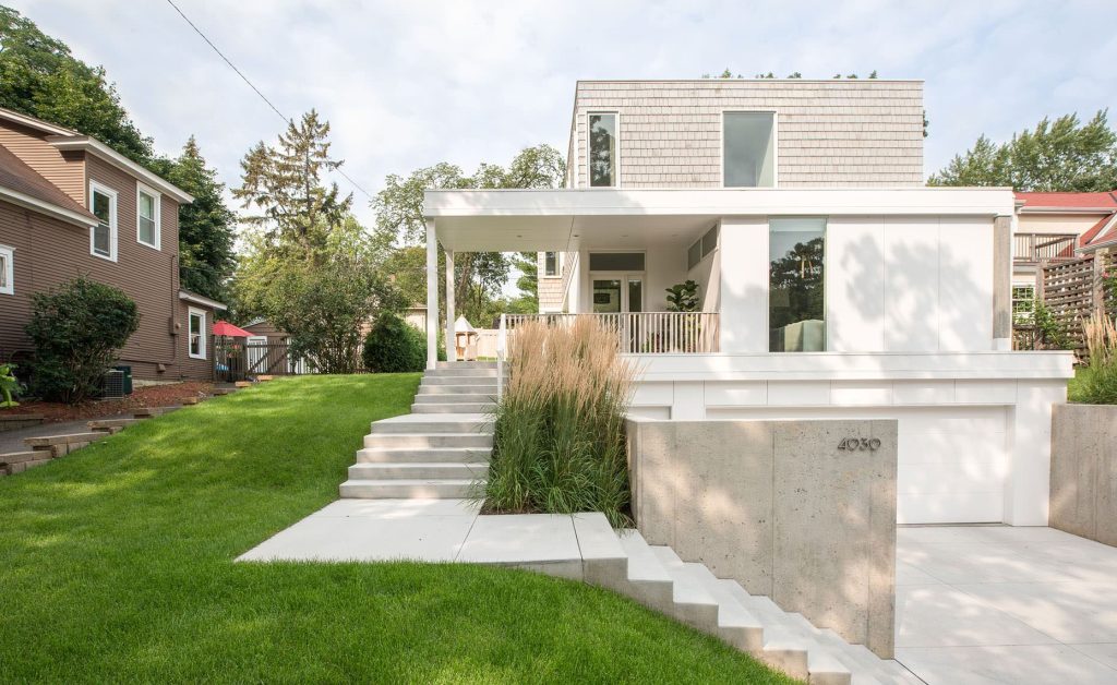 An open front porch with a raised south facing side yard. House is setback incrementally from front facing tuck under garage. Cedar shake siding is left to weather naturally. Photo by Chad Holder. by CHRISTIAN DEAN ARCHITECTURE, LLC | Outdoor Photos | Porch | Landscaping | Landscape Design | Outdoor Living Space | Porch Design Ideas | Outdoor Living Space Ideas | Backyard Design