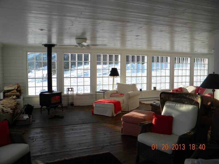 Another view of the sun porch with the wood stove. Even on cold, Newfoundland days when the sun shines the room warms and fulls the entire house with heat. Hope Young, contractor. Photo credits, Linda Wilkoff by sortie | Outdoor Photos | Porch | Landscaping | Landscape Design | Outdoor Living Space | Porch Design Ideas | Outdoor Living Space Ideas | Backyard Design