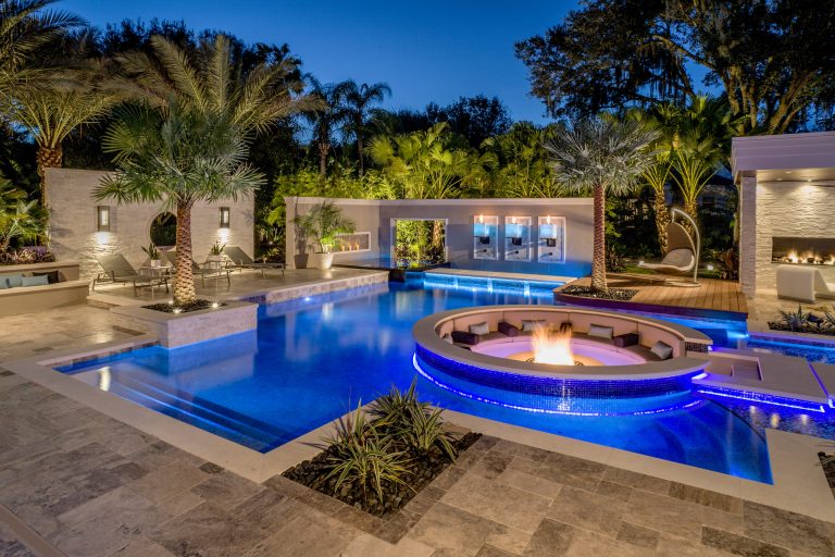 Appearing to float within the pool, the 8 foot circular lowered fire lounge and patio area provides a prime vantage point for embracing the total outdoor experience. Photography by Joe Traina