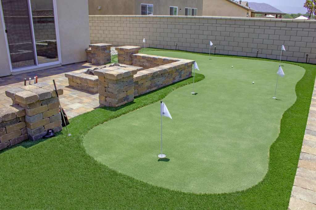 Artificial Grass Putting Green, Fire Pit, Seat Wall and Pavers.