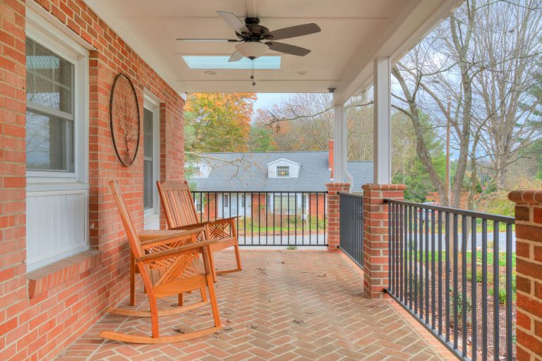 Arts and crafts brick front porch photo in Other with a roof extension by Slate Creek Builders | Outdoor Photos | Porch | Landscaping | Landscape Design | Outdoor Living Space | Porch Design Ideas | Outdoor Living Space Ideas | Backyard Design