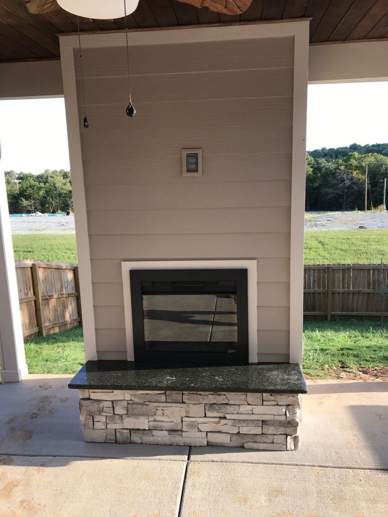 Arts and crafts concrete porch idea in Nashville with a roof extension