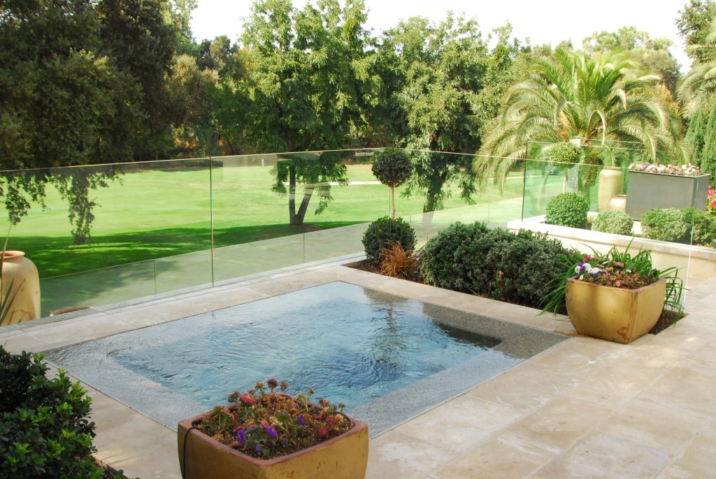 At the rear of the property, a separate spa off the master bedroom, overlooks the bluff and golf course below.