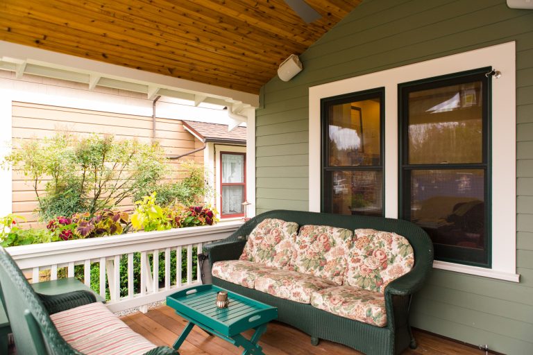 Attached flower and plant box. Wicker furniture. Marvin Integrity windows. Cedar ceiling. Ipe hardwood decking.Inspiration for a small timeless front porch remodel in Portland by Winsome Construction | Outdoor Photos | Porch | Landscaping | Landscape Design | Outdoor Living Space | Porch Design Ideas | Outdoor Living Space Ideas | Backyard Design