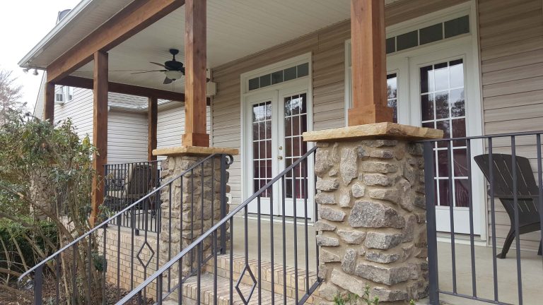 Back Porch: Custom handrails wrap all around, and beautifully accent stone and wood work.