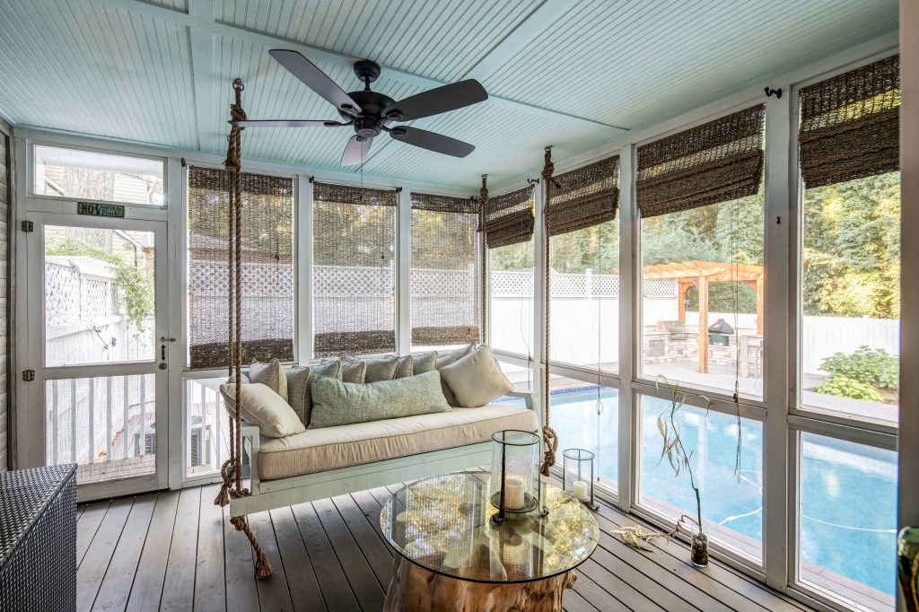 Back porch renovation with custom made bed porch swing