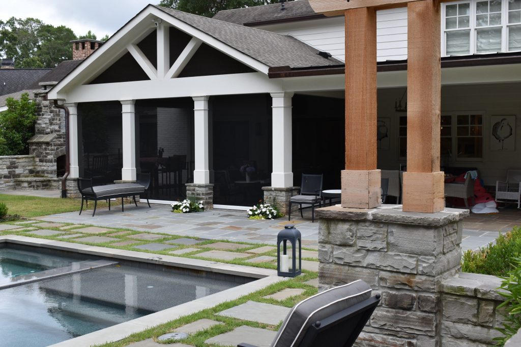 Backyard swimming pool, bluestone patio and screen poarch