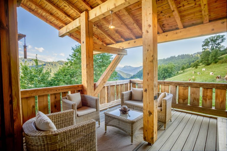 Balcony built on site in a rustic style using wood sourced by us and a composite long lasting deck. Photo by Petr Vujtech