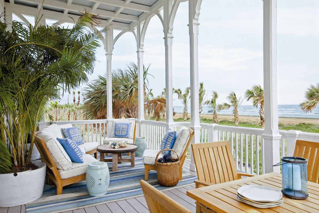 Beach style back porch idea in Austin with decking and a roof extension by Michael G Imber, Architects | Outdoor Photos | Porch | Landscaping | Landscape Design | Outdoor Living Space | Porch Design Ideas | Outdoor Living Space Ideas | Backyard Design