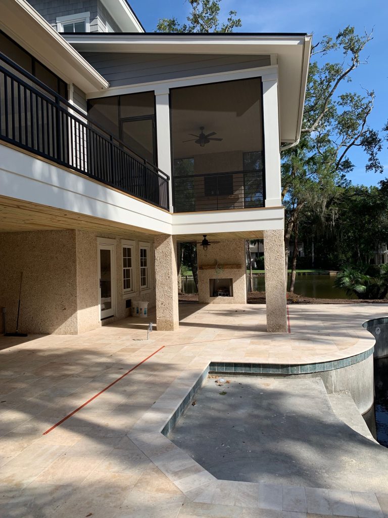 Beach style back porch idea in Charleston with a fireplace, decking and a roof extension by JL Designs of Hilton Head Island, Inc | Outdoor Photos | Porch | Landscaping | Landscape Design | Outdoor Living Space | Porch Design Ideas | Outdoor Living Space Ideas | Backyard Design